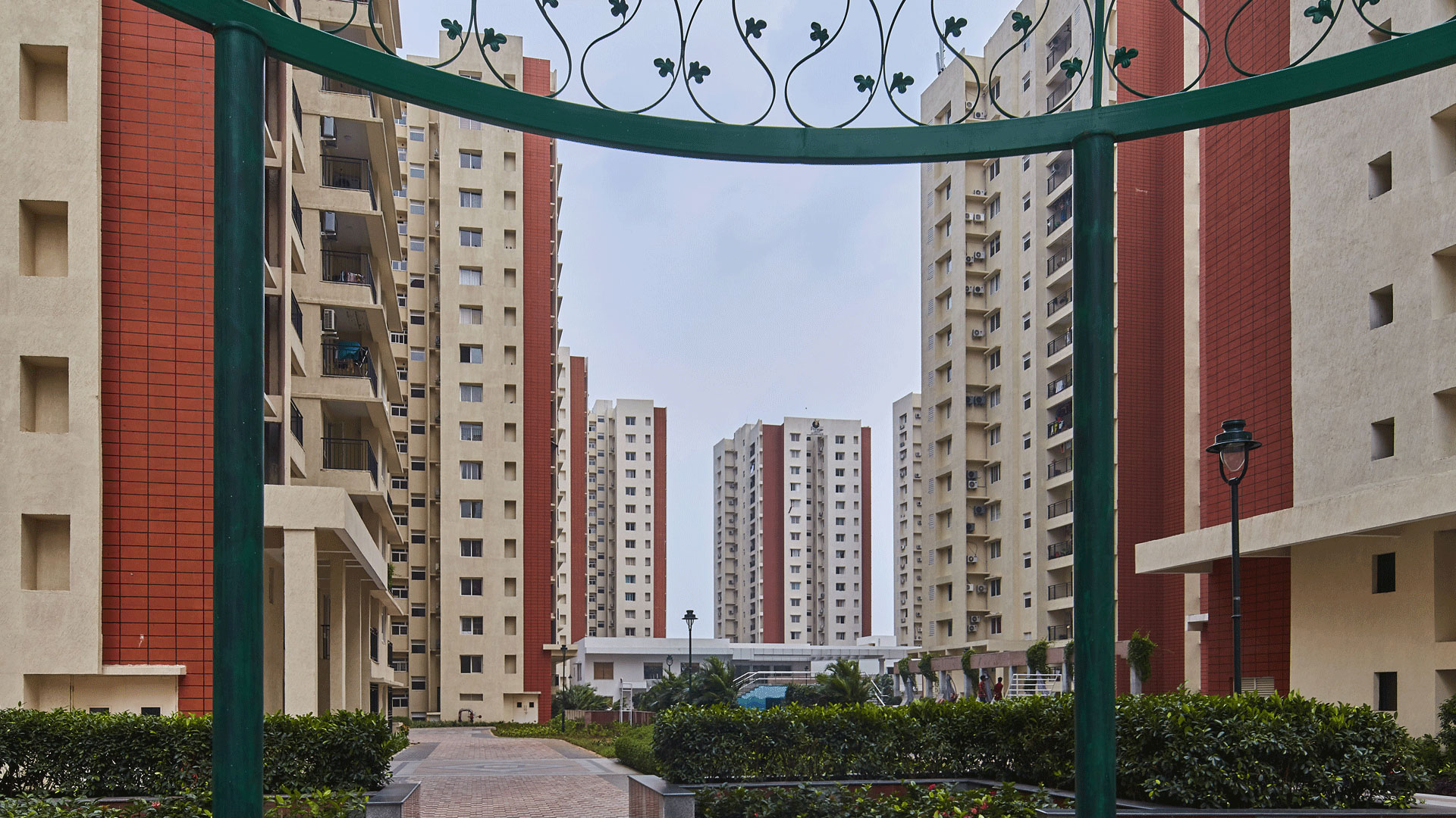 Internal landscaped walkway and apartment towers at Prestige Bella Vista.