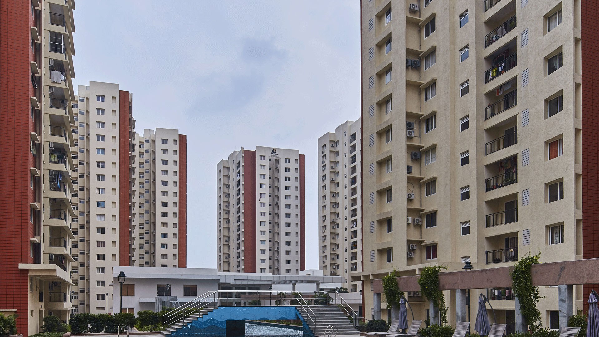 Prestige Bella Vista apartment towers and pool terrace.